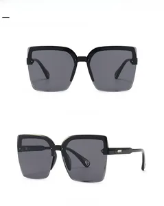 Front and 45-degree side views of black oversized square sunglasses with gradient lenses