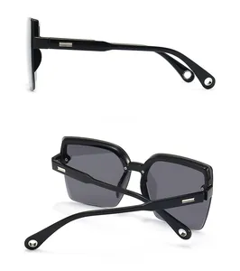 Detailed side and back views of black square sunglasses with silver metal temple accents