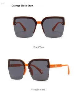Detail view of modern orange square sunglasses with gradient grey lenses and gold accents