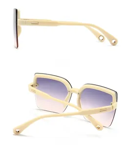 Detailed side and back view of cream square sunglasses with gold metal temple accents