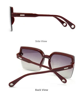 Burgundy cat-eye sunglasses featuring oversized frames and silver ring temple details