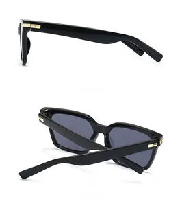 Vues détaillées latérales et arrière de lunettes papillon noires avec charnières dorées