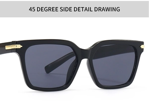 Détail de lunettes papillon avec charnière en métal doré et finition noir brillant