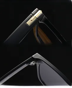 Détail des lunettes de soleil papillon noires avec charnières dorées et marquages