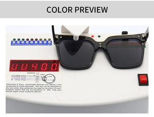 Detail shot of black square sunglasses on a UV400 tester showing full UV protection
