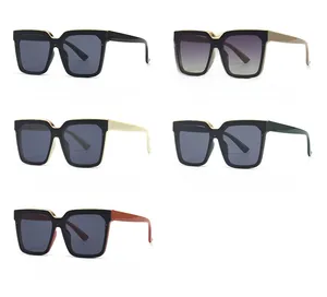 Detail view of square cat-eye sunglasses in five color variants with gold metal accents