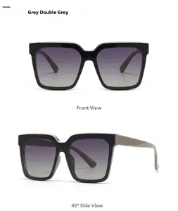 Front and 45-degree side view of oversized cat-eye sunglasses with gold metal trim accent
