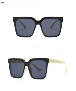 Front and 45-degree side views of black and gold square cat eye sunglasses with beige legs