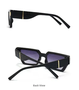 Close-up of square sunglasses featuring crocodile texture temples and gold accents