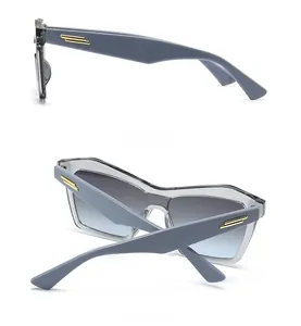 Side and back view of retro cat-eye sunglasses with gradient lenses and metal accents
