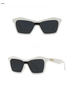 Cat eye sunglasses with off-white frames and gold metal temple details in dual views