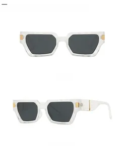 Detailed views of square butterfly sunglasses with marble texture and gold accents