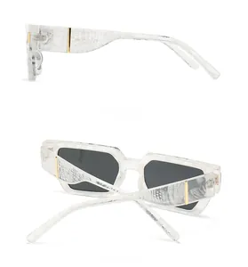 Detail view of square butterfly sunglasses featuring side and back golden hinges