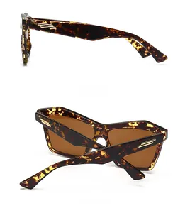 Detailed side and back views of tortoiseshell cat-eye sunglasses with gold metal accents