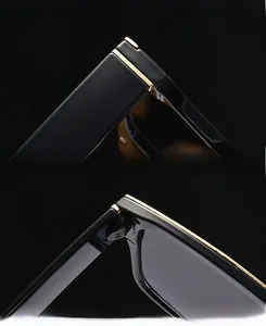 Detail of premium gold hinges and reinforced frames on black flat top sunglasses