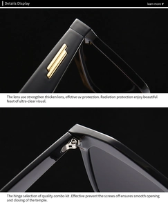 Detail of black cat-eye sunglasses with gold metal hinges and UV protection lenses