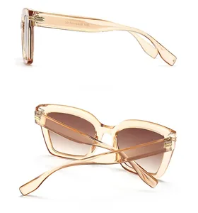 Details der bernsteinfarbenen Sonnenbrille mit Metallscharnier und Rückansicht