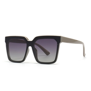 Modern oversized square cat-eye sunglasses with black frame and gradient lenses