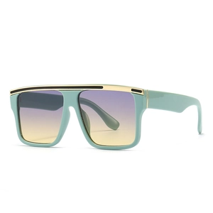 Oversize square mint green sunglasses with flat top gold metal trim and gradient lenses