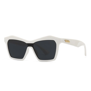 White cat-eye sunglasses with dark lenses and gold metal accents on the side frame