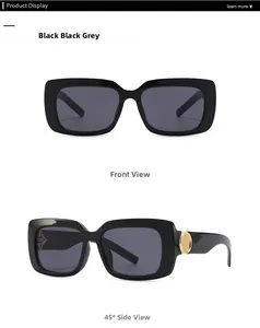 Detail view of marble-pattern sunglasses with thick black frame and golden metal accents