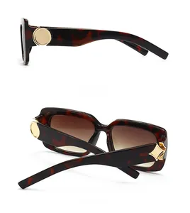 Detail of tortoise shell sunglasses showing side metal trim and back folding view