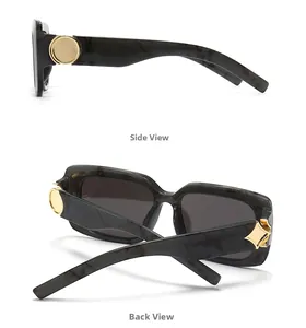 Detail view showing side and back of dark marble sunglasses with gold hinge accents