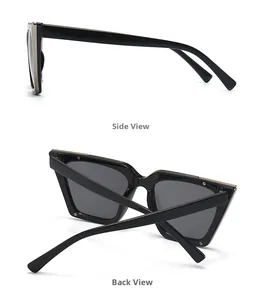 Detail view of square oversized sunglasses showing silver metal trim and dark grey lenses