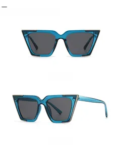 Front and side view of trendy cat-eye sunglasses with blue transparent frames and grey lenses
