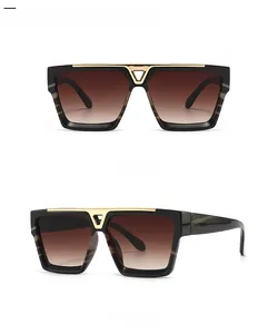 Flat top square sunglasses with dark tortoiseshell frames and gold V-bridge detail