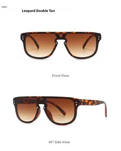 Detail of leopard print oversized sunglasses with gradient brown lenses and metal rivets