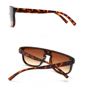 Side and back view of oversized tortoiseshell sunglasses with brown gradient lenses