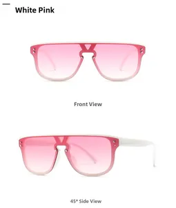Close-up of oversized white frame sunglasses with pink gradient lenses and metal studs
