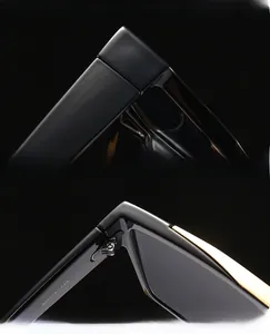 Macro detail of glossy black square sunglasses with reinforced metal hinges and UV lenses