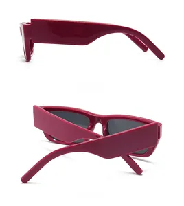 Detailed side and back views of trendy deep red rectangle sunglasses with grey lenses
