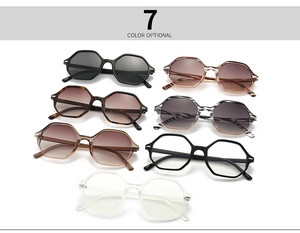 Flat lay of narrow hexagonal eyewear in seven colors including black and tortoiseshell