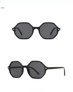 Front and side view of minimalist black hexagonal sunglasses with grey lenses