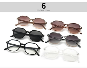 Flat lay display of hexagonal eyeglass frames in six diverse colors and lens tints