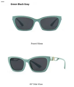 Cat eye sunglasses with mint green frame and gold hollow metal detail on temples