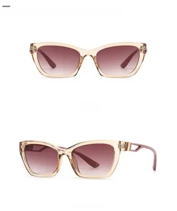 Cat eye sunglasses detail in champagne gold frame with double tan gradient lenses