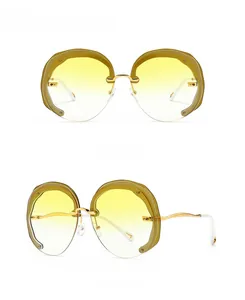 Front and side view of rimless wavy sunglasses with yellow gradient lenses and gold frame