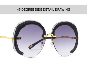 Detail view of purple gradient oversized round lens with gold wavy metal temple and frame