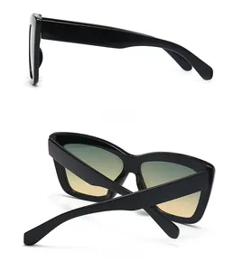 Vues latérale et arrière de lunettes œil-de-chat noires avec verres dégradés jaune-vert
