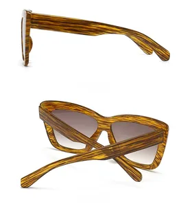 Détails de la monture à grain de bois et verres dégradés marron de ces lunettes de soleil