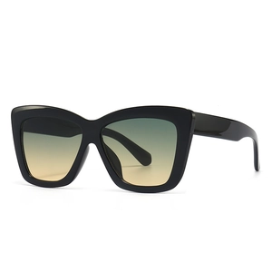 Lunettes de soleil œil de chat rétro avec monture noire et verres dégradés orange