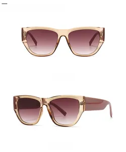 Front and 45 degree side view of light tan cat eye sunglasses with reddish gradient lenses