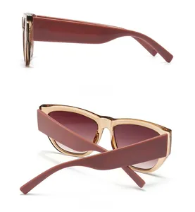 Detail view of vintage cat eye sunglasses showing gradient lenses and matte brown temples