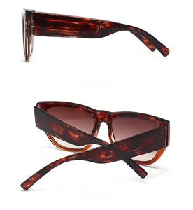 Side and back view of tortoiseshell cat-eye sunglasses with wide frames and brown lenses