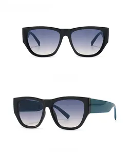 Front and side view of trendy black cat-eye sunglasses with blue gradient lenses