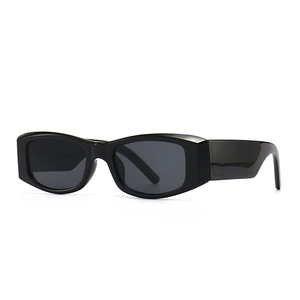 Retro rectangle sunglasses in black gloss resin with dark grey lenses shown at a side angle